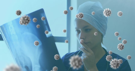 Analyzing X-ray in hospital, medical professional surrounded by virus illustrations. Healthcare,...