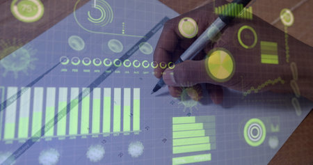 Image of Covid 19 cells and statistics showing cases over person writing. Global coronavirus Covid...
