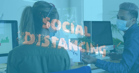 Image of words social distancing with work colleagues social distancing in office. healthcare and protection during coronavirus covid 19 pandemic, digitally generated image.の写真素材
