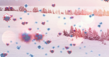 Image of multiple covid 19 cells floating against winter scenery. christmas during coronavirus pandemic concept digitally generated image.の写真素材