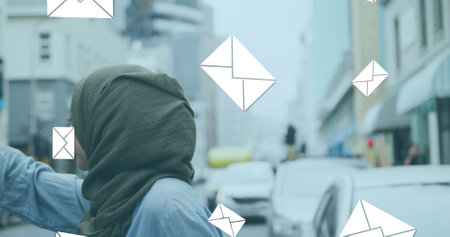 Image of floating mail icons with woman in hailing taxi in street. communication technology digital...