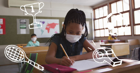 Image of school items icons over schoolgirl in face mask writing. global covid 19 pandemic, education and learning concept digitally generated image.の写真素材