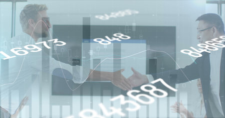 Financial data processing and changing numbers against two business man shaking hands at office....