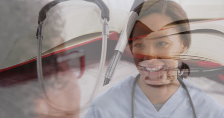 Image of stethoscope over female doctor with senior woman smiling. global coronavirus pandemic, medicine and healthcare concept digitally generated image.の写真素材
