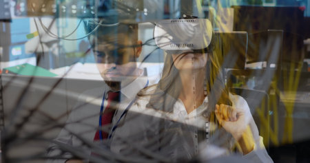 Virtual reality technology and data processing over business professionals in office. innovation,...