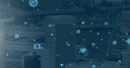 Image of digital icons over cityscape on blue background. global connections, technology and digital interface concept digitally generated image.の写真素材