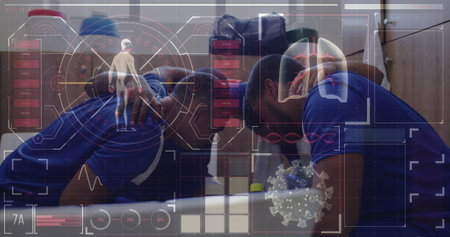 Digital interface with data processing against team of male soccer players making a huddle. sports, fitness and technology conceptの写真素材