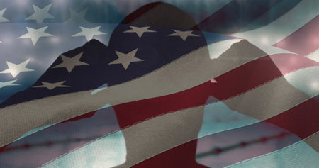 Waving american flag over silhouette of male swimmer wearing swimming glasses against swimming pool. sports competition and tournament conceptの写真素材