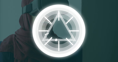 Image of circles and triangles pulsating over woman wearing vr headset. global science, digital interface, technology and networking concept digitally generated image. wの写真素材