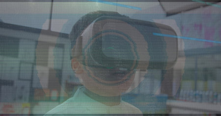 Image of scope scanning with glitch and boy using vr headset. global data processing, communication, digital interface, technology and networking concept digitally generated image.の写真素材