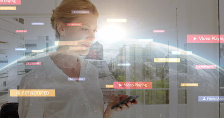 Image of social media icons over woman using smartphone. global social media, communication, digital interface, technology and networking concept digitally generated image.の写真素材