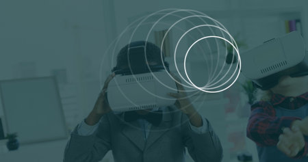 Image of scopes scanning over children wearing vr headsets. global digital interface, technology and...