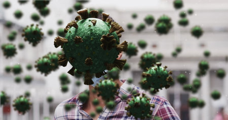 Image of covid 19 cells over caucasian man wearing face mask. Global covid 19 pandemic and health...
