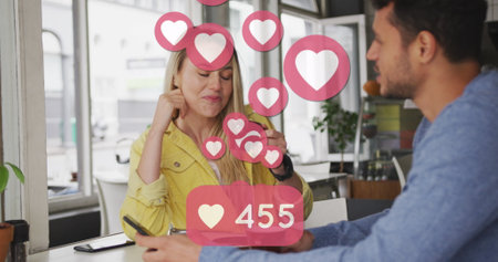 Image of heart icons floating over caucasian couple in love drinking coffee. social media and...