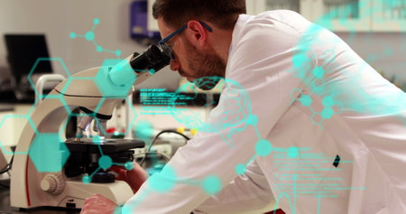 Image of scientific data processing over male scientist using microscope. global science, research, data processing and digital interface concept digitally generated image.の写真素材