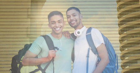 Image of biracial male friends smiling over cityscape. leisure and friendship concept digitally generated image.の写真素材