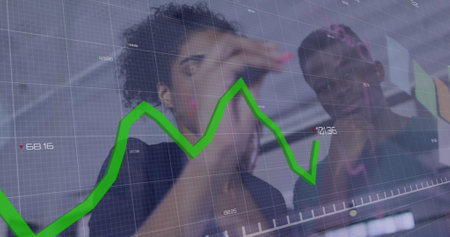 Image of statistic chart over diverse male and female business colleagues talking in office. global...