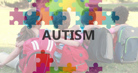 Image of autism awareness month text over puzzle and schoolchildren embracing. autism awareness...