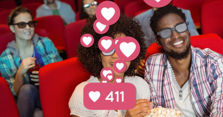Image of heart icons over smiling african american couple eating popcorn in cinema. popcorn day and...