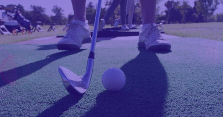 Image of light trails over caucasian man playing golf on golf course. global sports, golf and healthy lifestyle concept digitally generated image.の写真素材