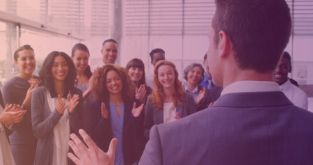 Image of smiling group of diverse business people clapping at meeting. work and business concept digitally generated image.の写真素材