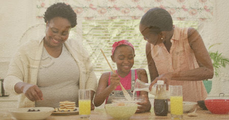 African american grandmother, mother and granddaughter baking together. Cooking conceptの写真素材