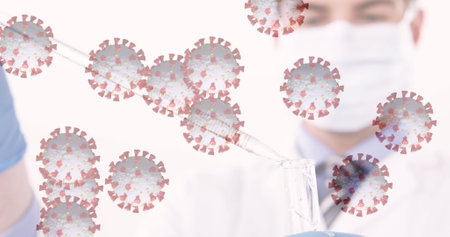 Image of virus cells floating over caucasian doctor with face mask taking sample. global medicine during covid 19 pandemic concept digitally generated image.の写真素材