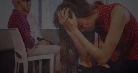 Textured scratched overlay against stressed african american woman holding her head at office....