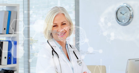 Image of chemical formulas and data processing over happy caucasian senior female doctor. medicine, health and technology concept digitally generated image.の写真素材