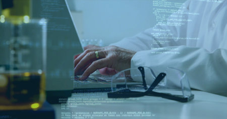 Researcher hands are typing on laptop with code overlay, safety glasses in flat design, technology. Scientist, innovation, technology, data, science, laboratory, experimentationの写真素材