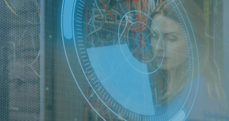 Image of data processing over caucasian woman inspecting server room. global technology and digital interface concept digitally generated image.の写真素材