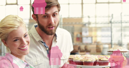 Image of caucasian couple smiling and buying cake. national cake day and celebration concept digitally generated image.の写真素材