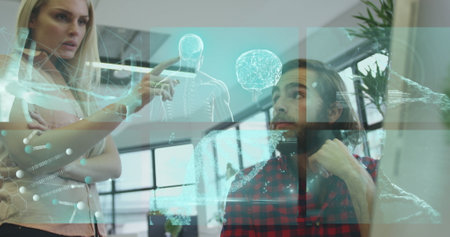 Scientists collaborating at computer workstation in lab, showing animated data graphs and icons