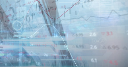 Medical team collaborating around laptop, displaying animated patient chart and floating heart iconの写真素材