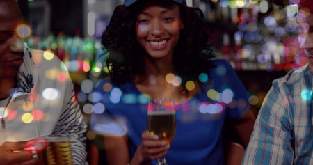Image of beer icons over happy diverse friends with beer in bar. national beer day and celebration concept digitally generated image.の写真素材