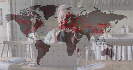 Image of data processing over senior biracial man using laptop. global business, finances, connections and digital interface concept digitally generated image.の写真素材