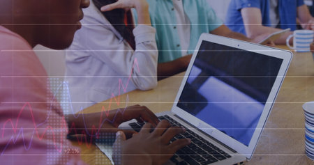 Statistical data processing against african american man using a laptop at office. business...