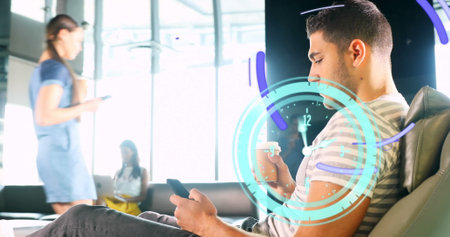 Image of clock moving over biracial businessman using smartphone. global business and digital...