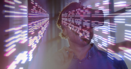 Image of moving columns over caucasian man using vr headset. global technology, social media and digital interface concept digitally generated image.の写真素材