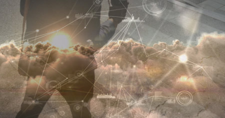 Image of data processing over african american businessman walking. global sport and digital...