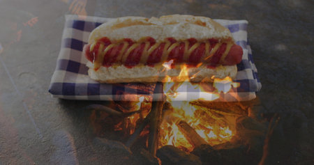 Image of flame over hot dog and cloth. american culture, tradition and patriotism concept digitally generated image.の写真素材