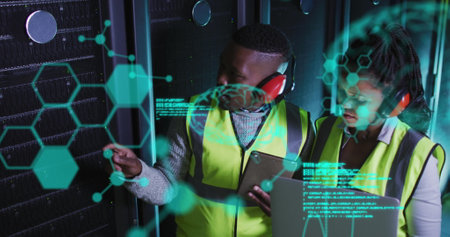 Image of data processing over african american workers in server room. global business, cloud computing and digital interface concept digitally generated image.の写真素材