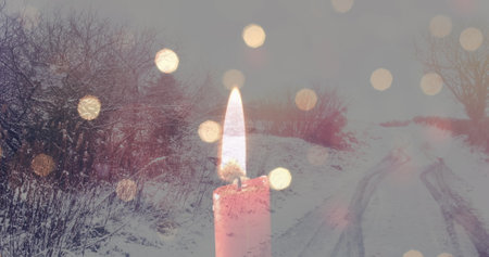 Image of candles over winter road landscape. winter, christmas and coziness concept digitally generated image.の写真素材