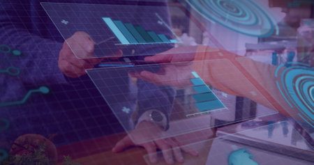 Image of graphs on digital screen over hands of caucasian man using contactless payments. global business, finance, economy and technology concept digitally generated image.の写真素材