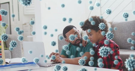 Father and son exploring virus particle overlays on silver laptop in living room, with abacus toy. Family, education, technology, childcare, health, domestic, interactionの写真素材