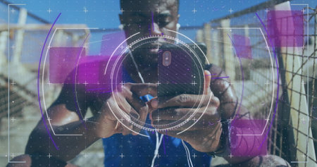 Image of scope scanning over african american man using smartphone outdoors. health and fitness...