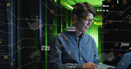 Image of data processing over asian male worker in server room. global business and digital...