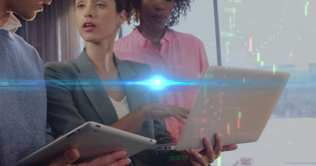 Image of lights and graphs over midsection of diverse businesspeople working in office. business,...