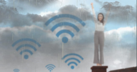 Image of wi fi icons over woman and rainy sky. Network, wireless connections and technology concept digitally generated image.の写真素材