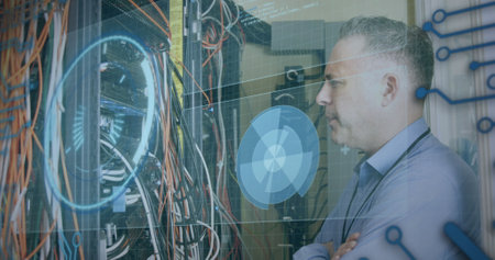 Image of data processing over caucasian man checking servers. computers, network, data processing,...